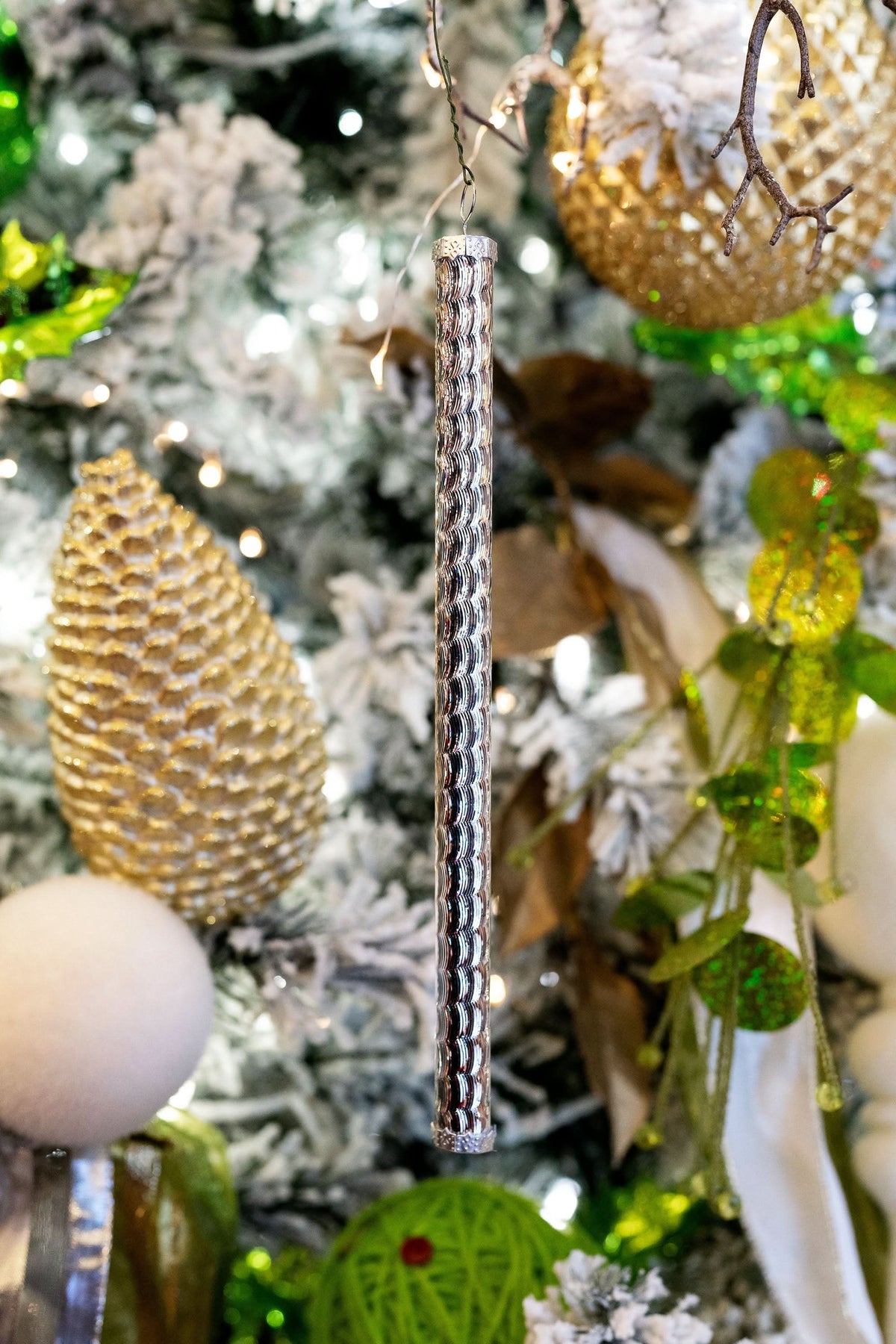 Dekra-Lite Spiral Reflective Tube Ornament on Tree Close Up